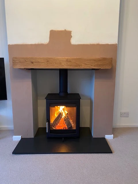 A wood burning stove supplied and fitted by The Fireplace & Stove Co.