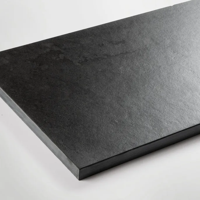Large-format dark slate with a matt finish, as used for the hearth