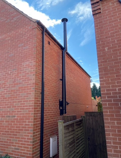 Powder-coated black external twin-wall insulated flue fitted to the Cannock home