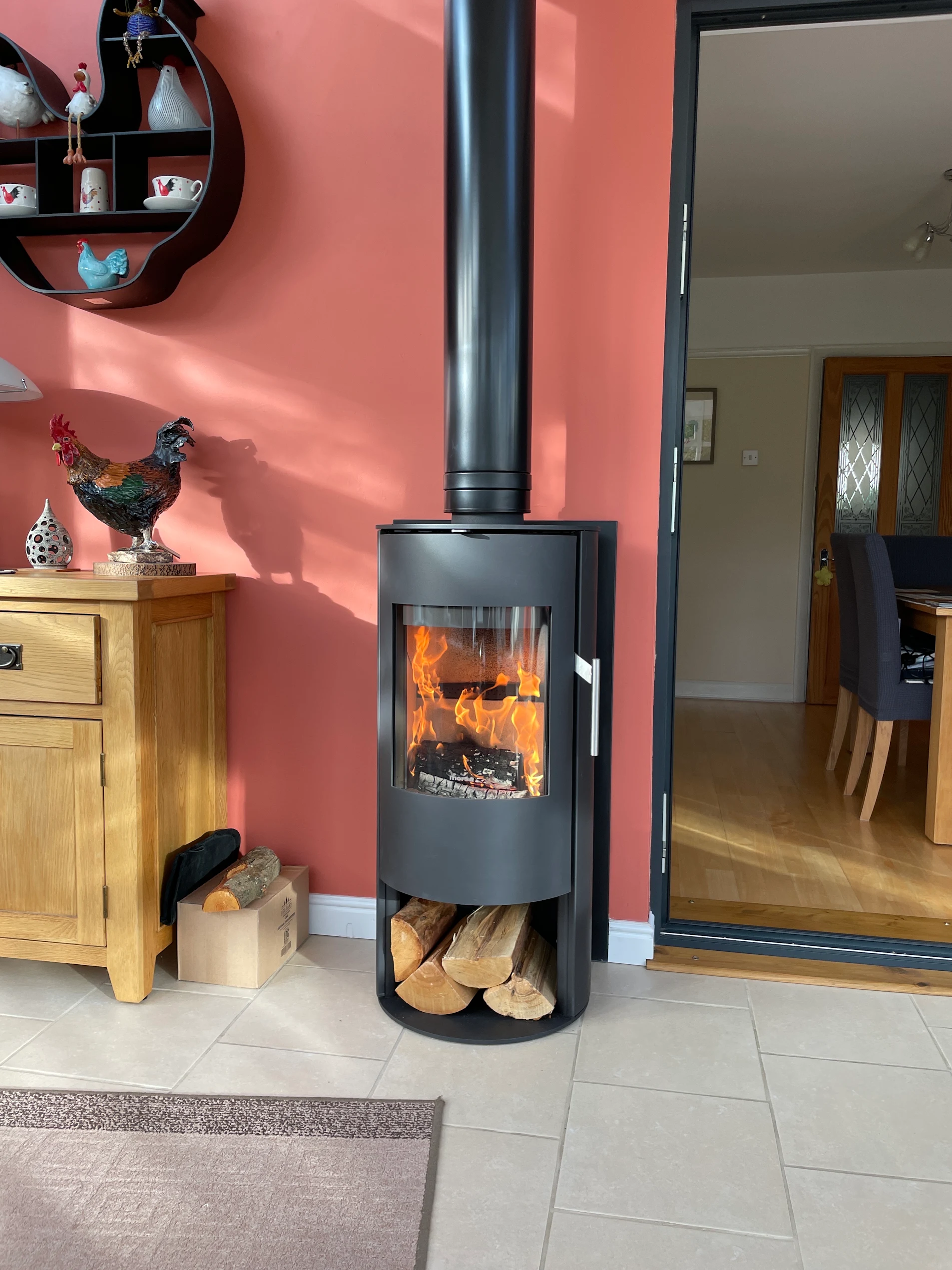 A wood burning stove fitted in a conservatory by The Fireplace & Stove Co.
