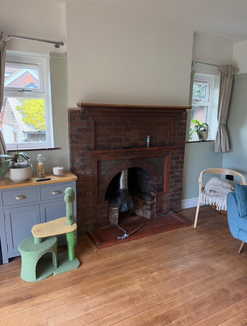 The original brick arch and fireplace opening recorded during the Tamworth home survey