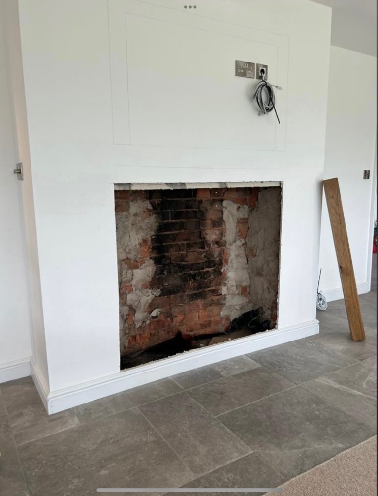 The original chimney breast opening before the Ashbourne fireplace installation