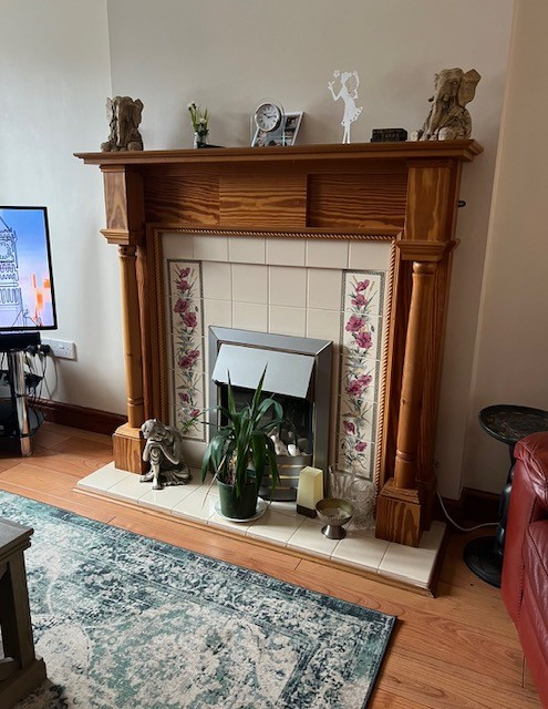 The original timber surround, tiled fireplace and electric fire before the Burton upon Trent installation
