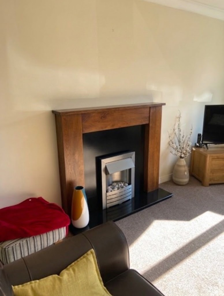 The flat original fireplace wall recorded at survey stage before the Cannock installation