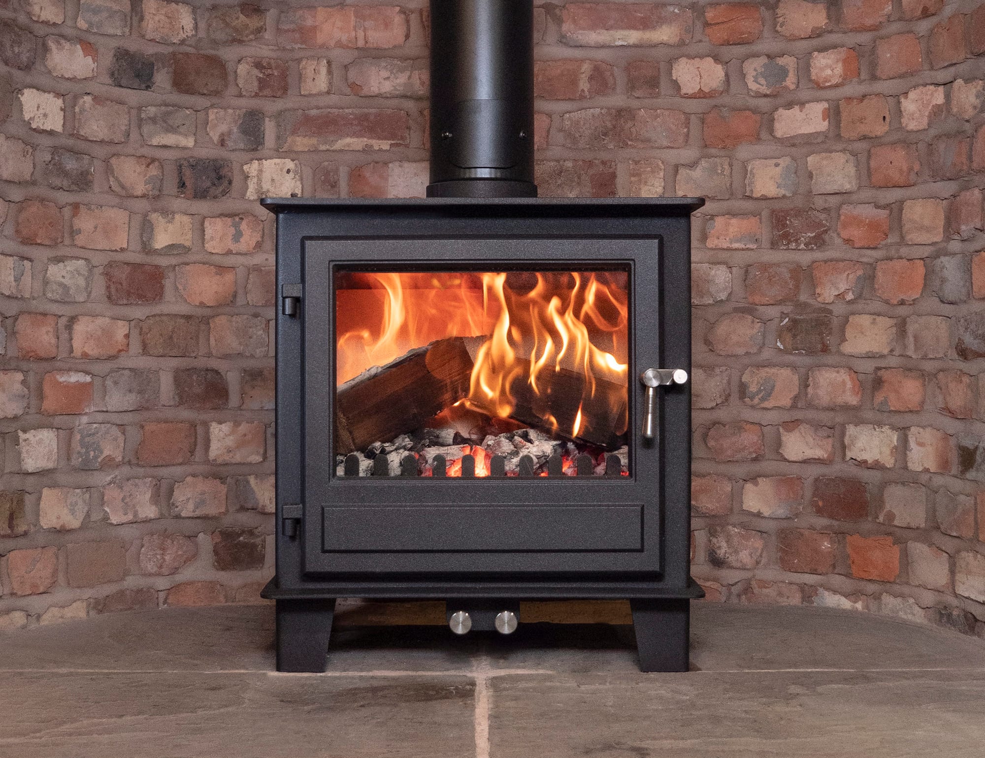 Clock Blithfield 8 stove in a fireplace setting