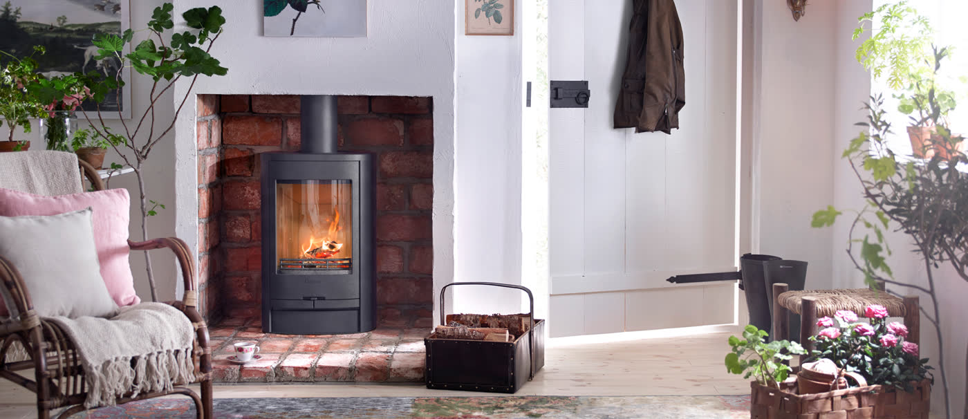 A Contura wood burning stove set into a styled living room