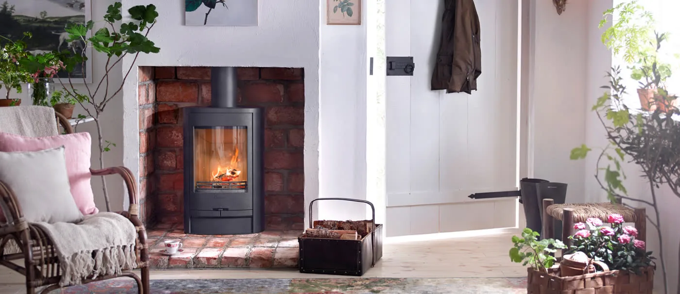 A Contura wood burning stove in a furnished living room