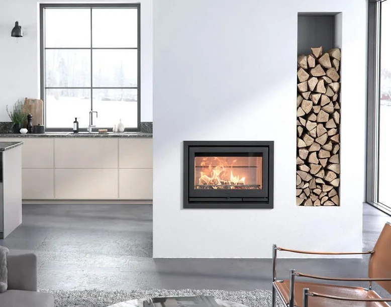 Contura i7 cassette woodburning stove built into a modern white fireplace wall