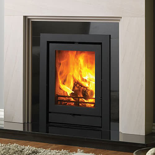 Fireline FPi5T inset wood burning stove in a fireplace setting