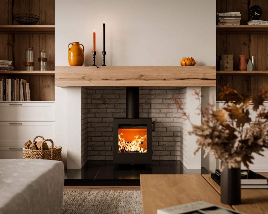 Kube 10 stove in a brick-lined fireplace below a timber beam
